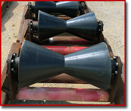 large black urethane V rollers on a sled