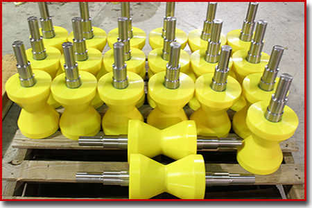 yellow urethane V rollers on a pallet