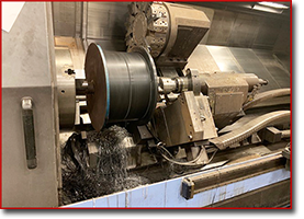 trimming groove on turning roller on Doosan lathe.