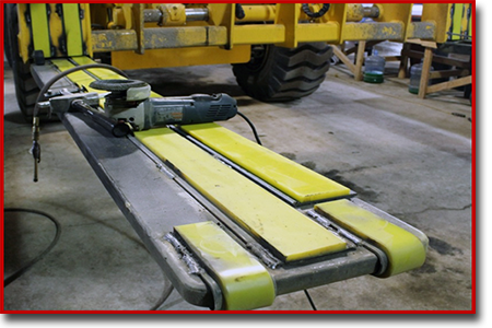 urethane toe guards and steel backed urethane strips on a forklift